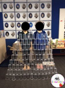 kids stacking a tower of 100 cups on the 100th day of school