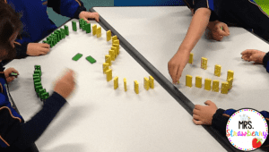 making a row of 100 dominoes for the 100th day of school